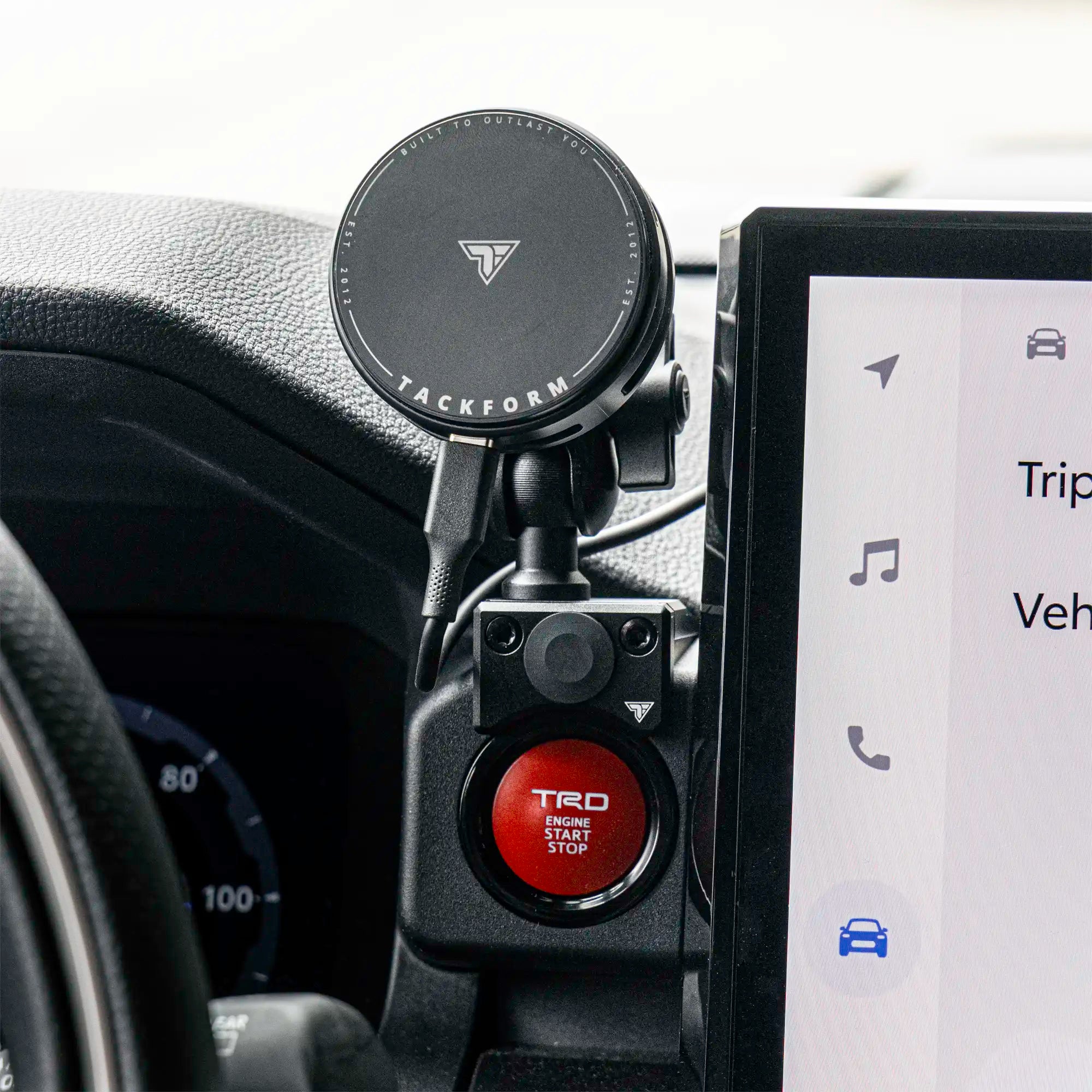 4th Gen Tacoma phone mount with 25w wireless charging installed in vehicle.