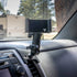 All-metal Tacoma phone mount with a billet spring-cradle phone holder installed on the passenger side vent