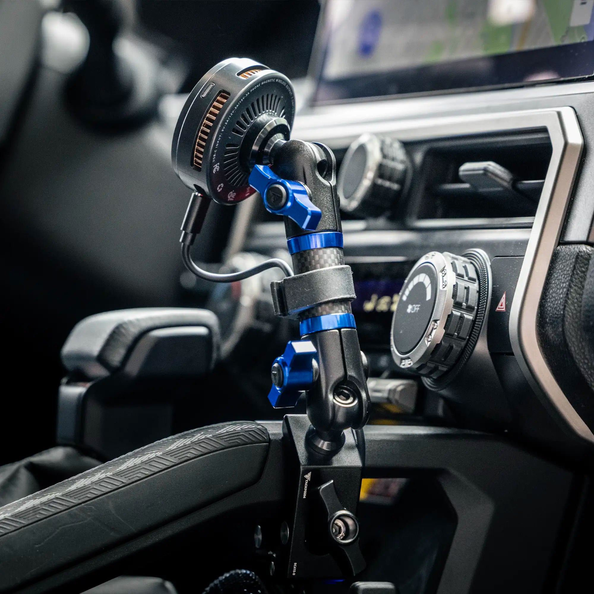 Toyota Tacoma Magsafe Charging Phone Mount with blue colored knobs installed in vehicle 